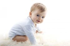 Cute Baby Boy on Fuffy Floor Photo