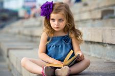 Cute Little Girl Reading Book