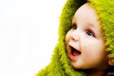 Cute Small Baby With Smile in Green Wallpapers