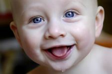 Cute Smile of Baby With Blue Eye Wallpapers