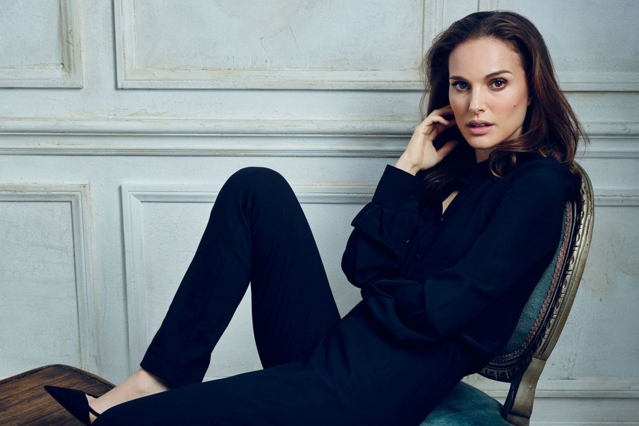 Actress Natalie Portman Sitting on Chair Wallpaper