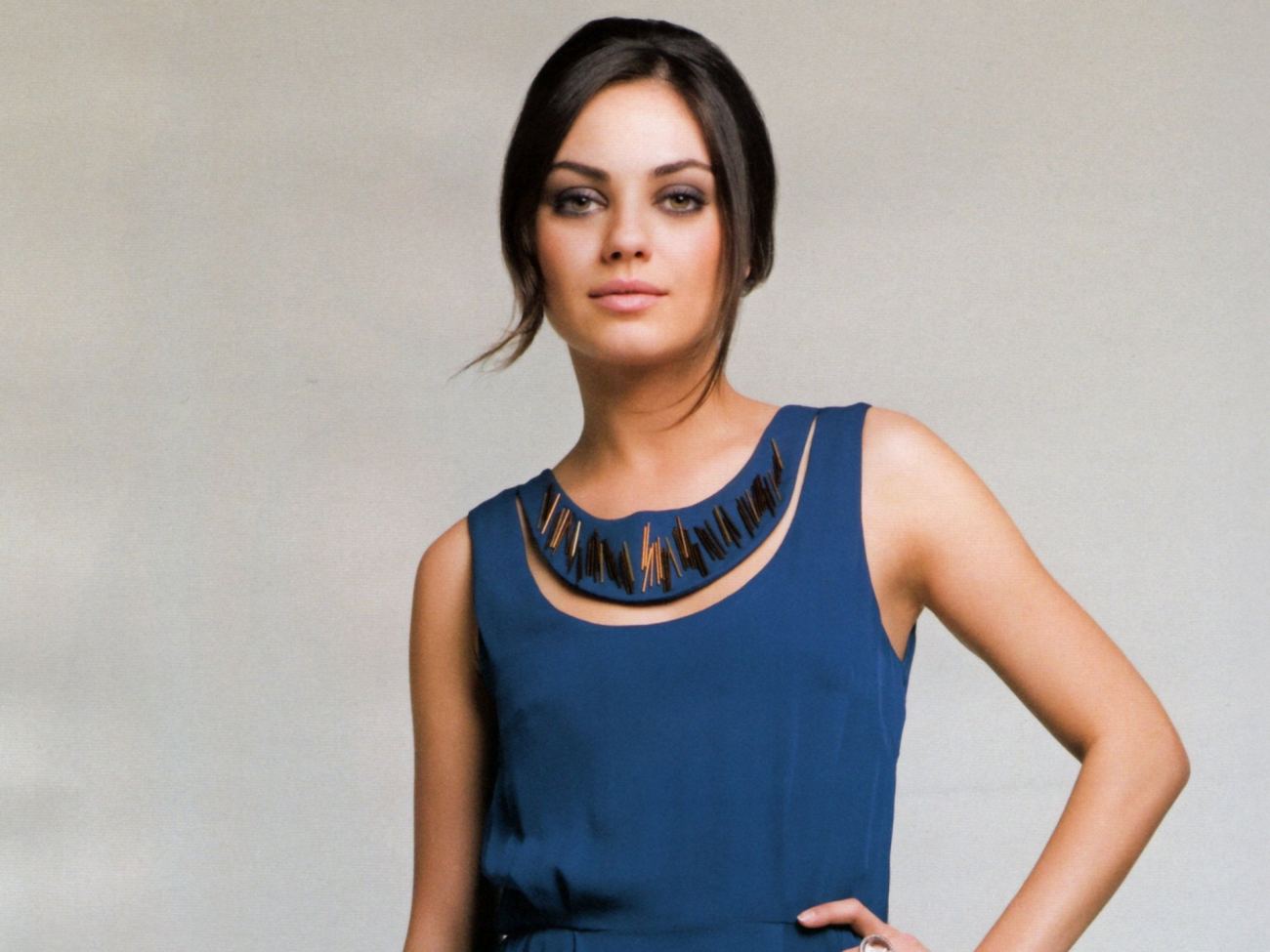 Actress Mila Kunis in Blue Wallpaper