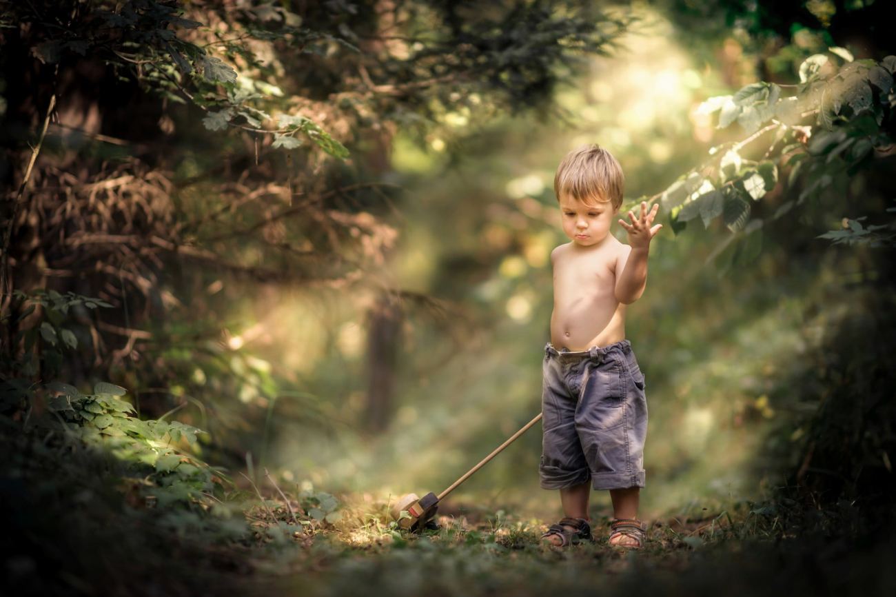 Black Shorts Little Boy Playing in Forest