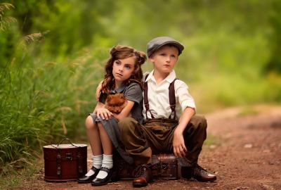 Cute Child Girl and Boy With Dog Sitting on Suitcases