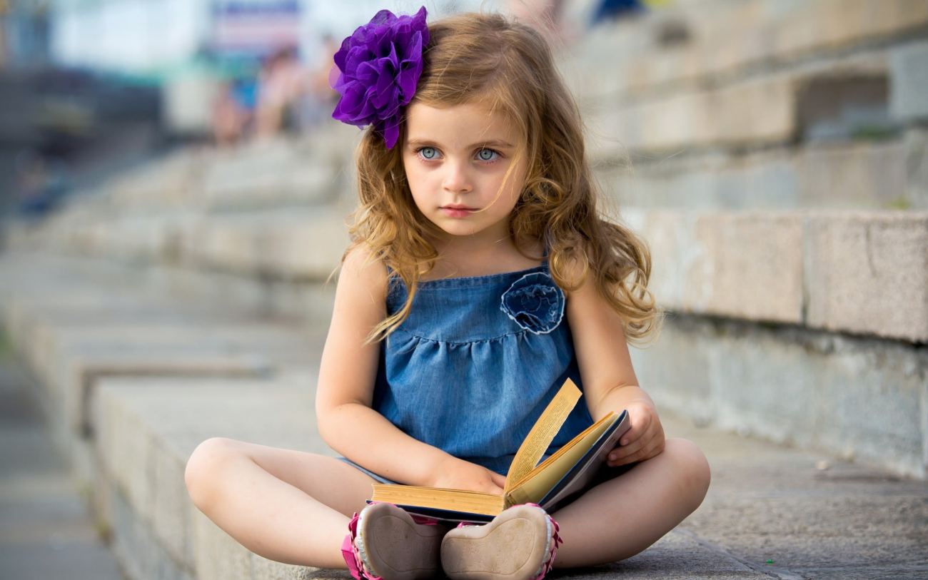 Cute Little Girl Reading Book