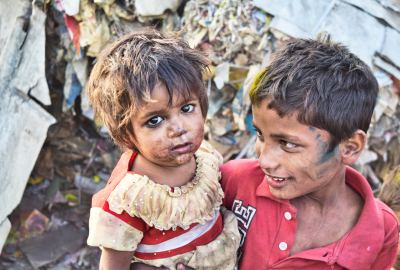 Poor Boy Carrying His Sister