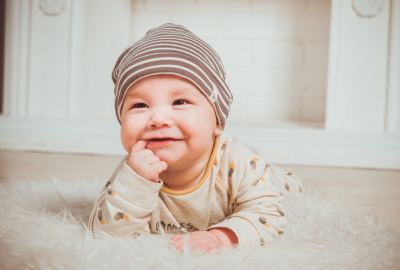 Smiling Baby Biting Right Index Finger